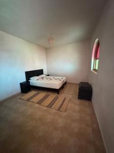 a bedroom with a bed and a window at Your Peaceful Spot in Essaouira +6 photos