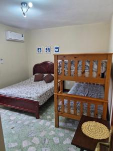 En eller flere senge i et værelse på Solar dos Reis