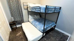 een paar stapelbedden in een kamer bij 100 Steps to Beach Great Value Pool apts in South Padre Island