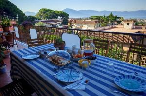 a blue table with food on top of a balcony at B&B Mareluce in Torre del Greco