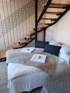 En eller flere senge i et værelse på Fanni Vendégház