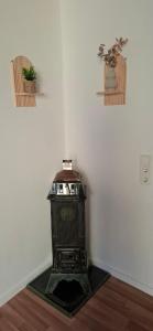 a corner of a room with a heater on the floor at Ferienwohnung Thomas in Adenbach +1 photo