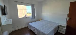 En eller flere senge i et værelse på Apartamento Vista Mar