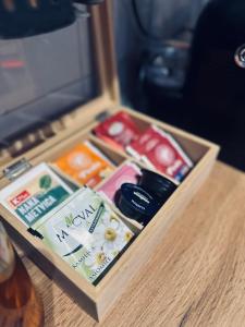 a wooden box filled with different items on a table at Apartman Viktorija in Žabljak +48 photos
