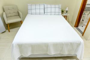 Кровать или кровати в номере Studio Completo a Minutos das Compras no Paraguai