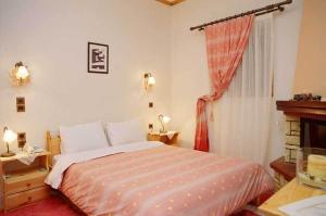 Postel nebo postele na pokoji v ubytování Guesthouse Irida