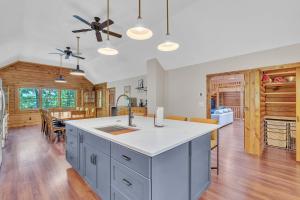 a kitchen with a large island in the middle at Gorgeous Lakefront Escape - New Renovations in Mineral +48 photos