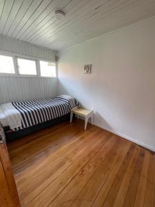 Postel nebo postele na pokoji v ubytování Acogedora Casa en Ancud Central Linda Vista