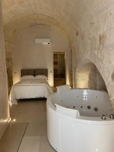 Postel nebo postele na pokoji v ubytování barbacana monopoli