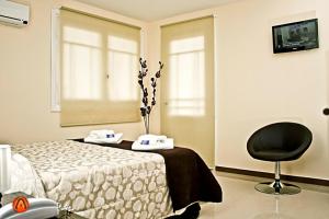 TV a/nebo společenská místnost v ubytování Hotel Esmeralda