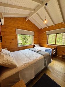 En eller flere senge i et værelse på Quinta Terra Sagrada