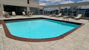 Swimmingpoolen hos eller tæt på Areia Flat vista mar piscina e ar