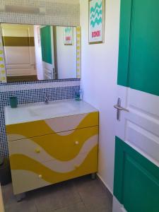 a bathroom with a sink and a mirror at Villa La Kaz a Gwada in Port-Louis +12 photos