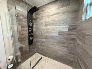 a bathroom with a shower with a glass door at The Elizabeth Suite in Key West +9 photos