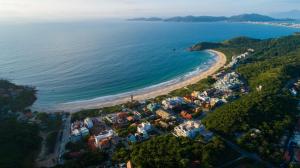 an aerial view of a village on the beach at Residencial DO MAR in Bombinhas