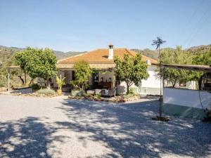 a house with a lot of trees in front of it at 5-Bedroom Villa with Pool, Swimjet and Jacuzzi in Comares