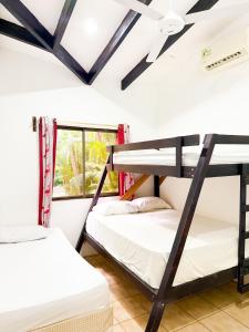 Ένα ή περισσότερα κρεβάτια σε δωμάτιο στο Selva Partners Tamarindo