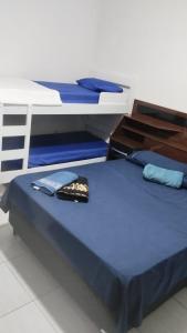 En eller flere senge i et værelse på Elaine