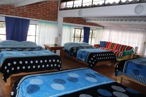 Postel nebo postele na pokoji v ubytování Casa Xitle