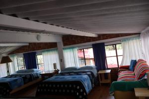 Postel nebo postele na pokoji v ubytování Casa Xitle