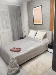 Postel nebo postele na pokoji v ubytování Bella Apartment