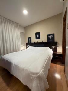 En eller flere senge i et værelse på Del Bono Suites