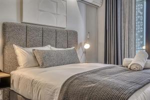 En eller flere senge i et værelse på Belle Vue at Ellipse + 6 billeder