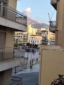 a view of a city street with buildings at Parastaseis Central Studio Georges Sq in Patra