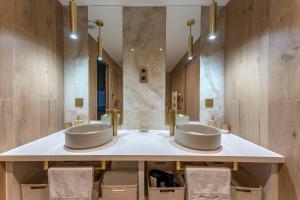 two sinks in a bathroom with two mirrors at Spa & Relaxation 15 min de Lyon - Noomi Suite in Oullins