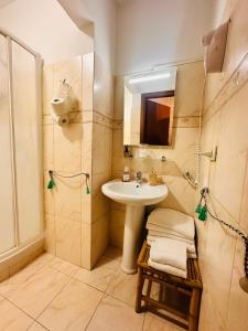 a bathroom with a sink and a shower at Soggiorno Madrid in Florence +117 photos