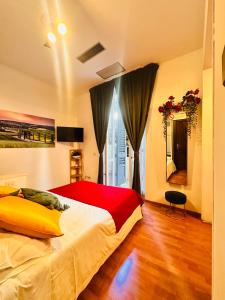 a bedroom with a large bed and a window at Soggiorno Madrid in Florence