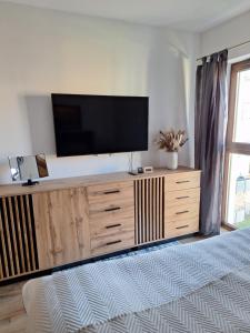 Et tv og/eller underholdning på JH Apartament