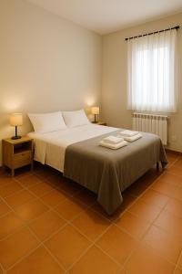 Postel nebo postele na pokoji v ubytování Can Ricart