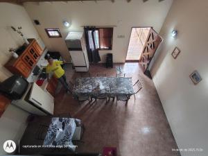 an overhead view of a kitchen with a table and chairs at Large Duplex #1 in San Bernardo