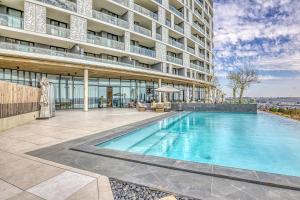 a swimming pool in front of a building at Bella Vista at Ellipse in Midrand