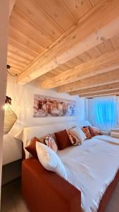 Ένα ή περισσότερα κρεβάτια σε δωμάτιο στο Maso K La Mucca Rossa