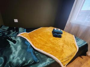 En eller flere senge i et værelse på Suite Lush - Centre-ville