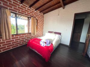 Postel nebo postele na pokoji v ubytování Serene Soul Arroyave