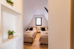 En eller flere senge i et værelse på Apartamenty Podmuch Halnego