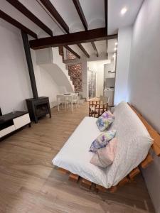 a bedroom with a large bed in a room at Restored house near Valencia in Simat de Valldigna +5 photos