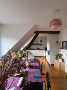 a dining room with a table and a kitchen at Cosy room in attic flat in the center of Zurich in Zürich +1 photo