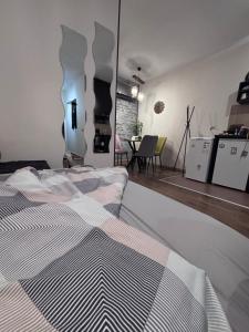 a bedroom with a bed and a dining room at Studio Stankovic Royal Towers 326 in Bansko +30 photos