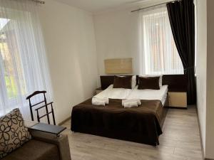 Una cama o camas en una habitación de Оселя Східниця