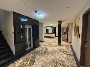 a hallway with a staircase in a building at Hotel Pragya Paradise in Indore +39 photos
