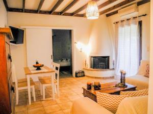 a living room with a couch and a table and a dining room at Lea's Ηοme in Kourouta