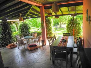 a patio with a table and chairs on a patio at Lea's Ηοme in Kourouta