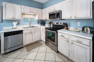 Køkken eller tekøkken på Sunset Cottages 5A Pet friendly condo