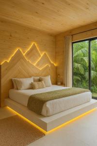Postel nebo postele na pokoji v ubytování Loop Eco Stone House HG