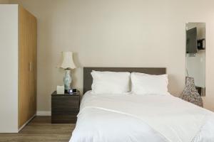 En eller flere senge i et værelse på Cozy Studio Near Balboa Park