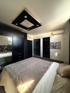 Ένα ή περισσότερα κρεβάτια σε δωμάτιο στο Jeanael suites